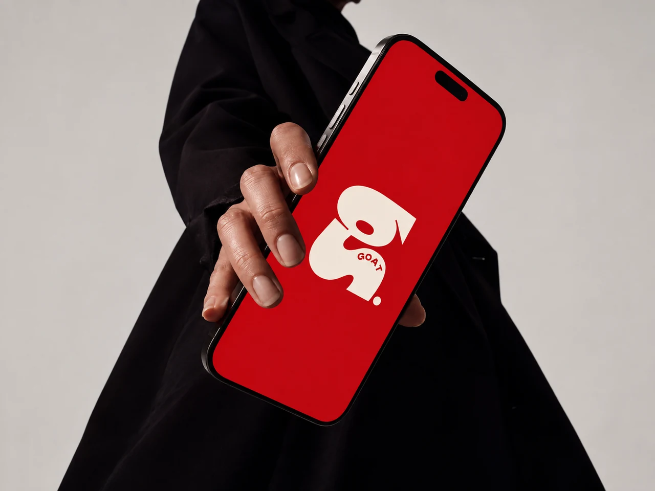 GOAT branding shown on a phone